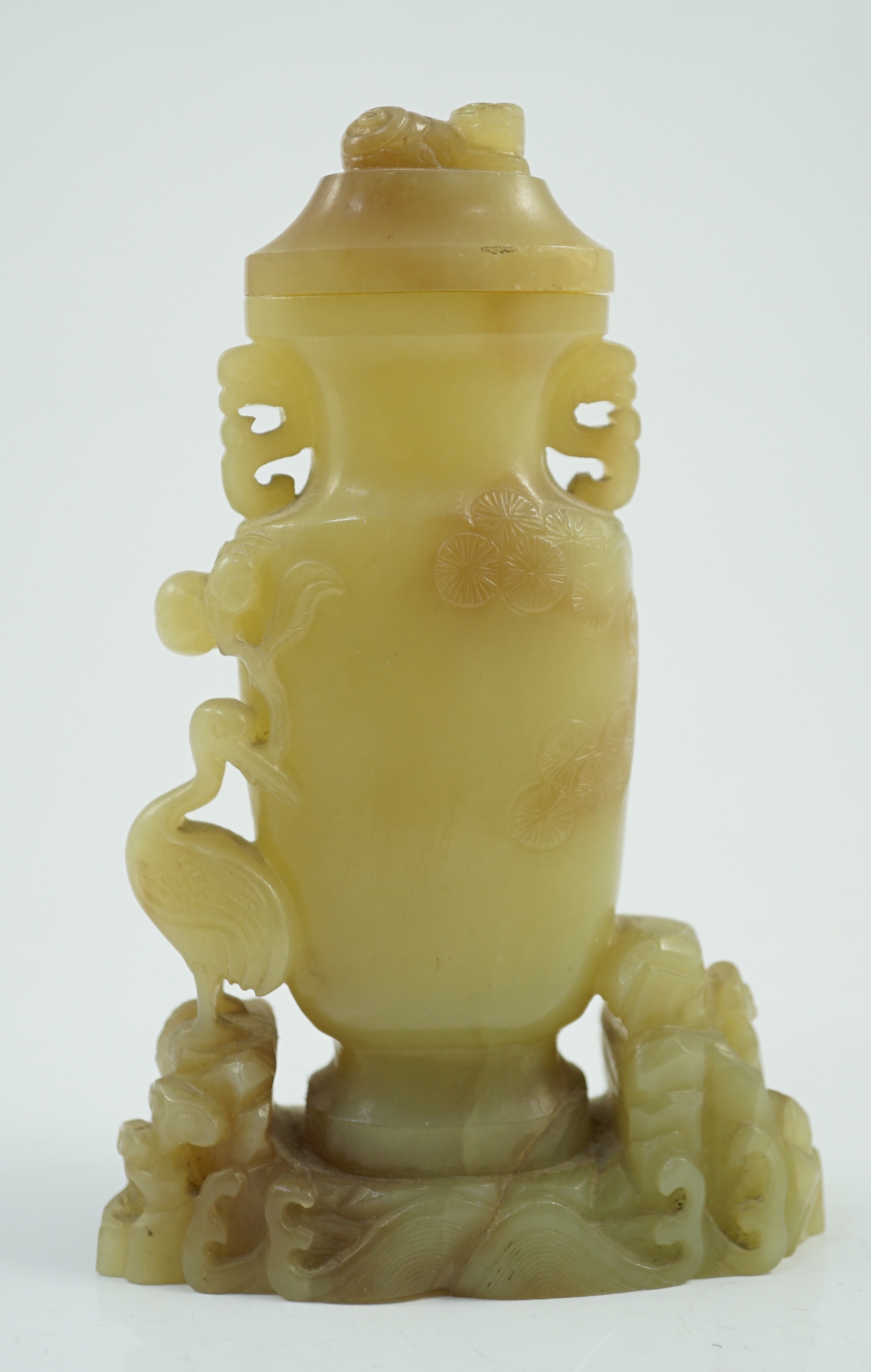 A Chinese yellow and russet jade vase and cover, 19th/20th century